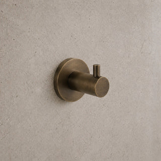 Reno antique brass robe hook on white background full view