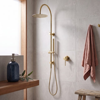 Reno polished gold shower mixer tap in modern bathroom lifestyle setting