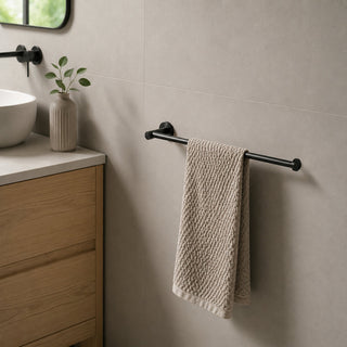 black hand towel holder in a modern bathroom with a timber vanity