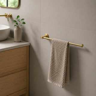brushed brass hand towel holder in a modern bathroom with a timber vanity