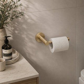 brushed brass toilet roll holder in a modern bathroom with a timber vanity