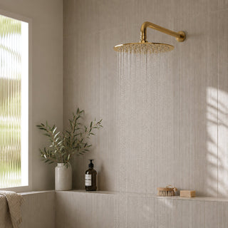 Reno polished gold rainfall shower head in lifestyle bathroom setting