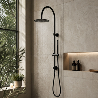 Black shower head and hose mounted on a tiled wall with a window and plant in the background.