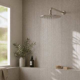 nickel rain head shower in a modern bathroom